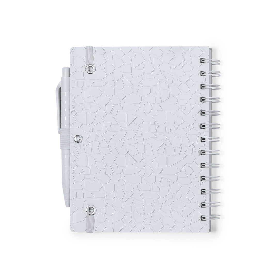 Set quaderno e penna con estratti di pietra