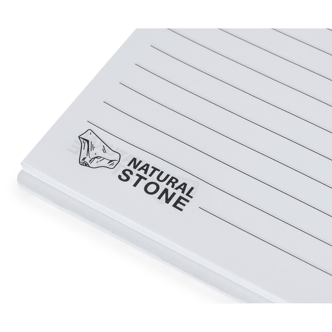 Set quaderno e penna con estratti di pietra