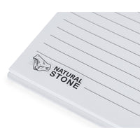 Set quaderno e penna con estratti di pietra