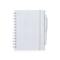 Set quaderno e penna con estratti di pietra